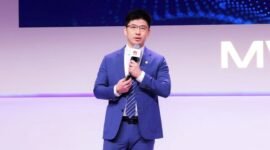 Arthur Wang delivering a keynote speech